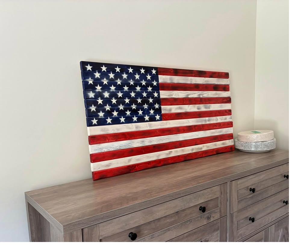 Wood American flag displayed on wall in home — patriotic wall decor