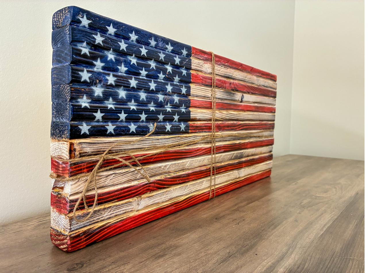 Small tabletop wood American flag wrapped in twine, a handcrafted patriotic gift sized for a desk or shelf